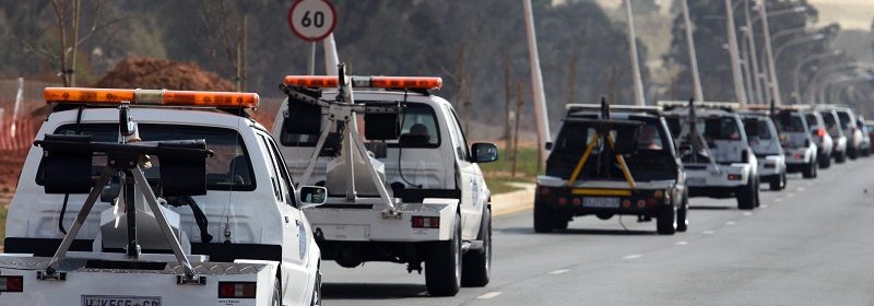 tow trucks driving on the road